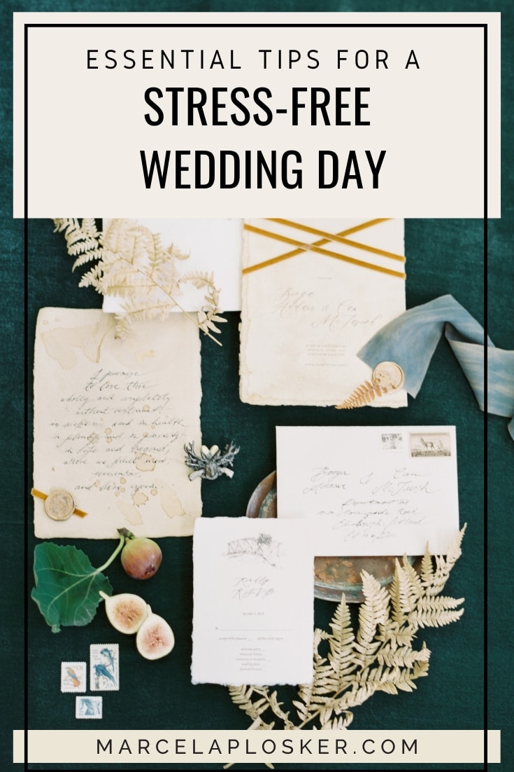 Wedding invites, envelope and other stationary on a dark green table, with text that reads Essential Tips For A Stress-Free Wedding Day