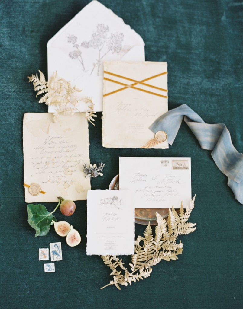 A couple's wedding invitations with other little trinkets and details from the wedding. Must-have wedding photos by Marcela Plosker, a Boston wedding photographer.