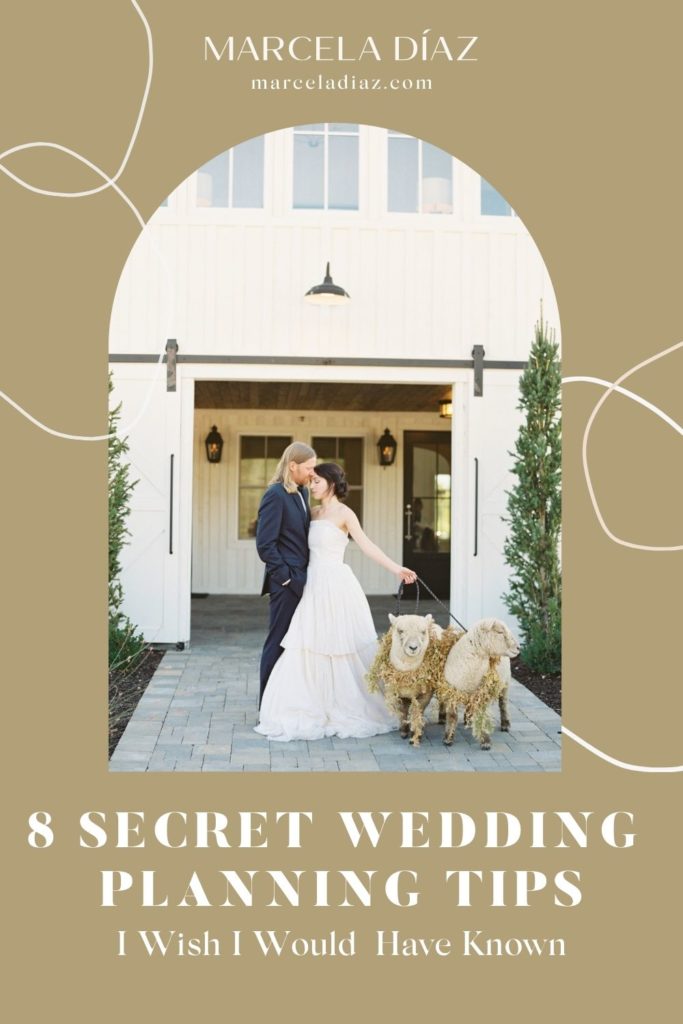 Bride and groom pose next to each other in front of a vintage house with the bride holding the leash of two sheep; image overlaid with text that reads 8 Secret Wedding Planning Tips I Wish I Would Have Known