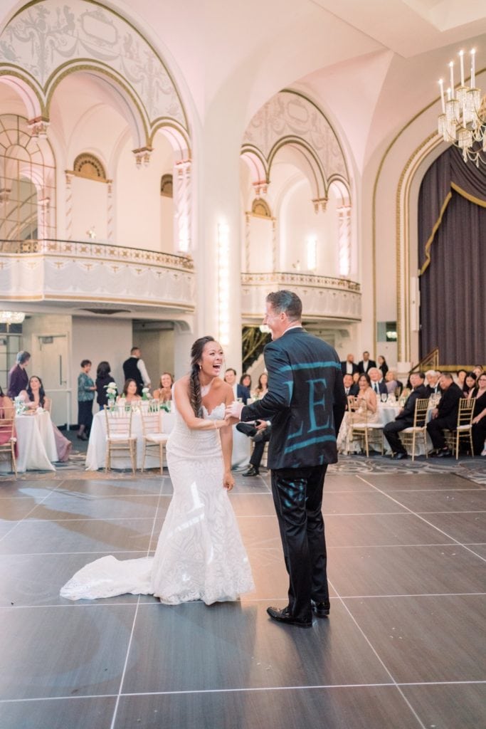 Bride and groom share a hearty laugh on the dance floor during their wedding reception at the Fairmont Copley Plaza in Boston, MA
