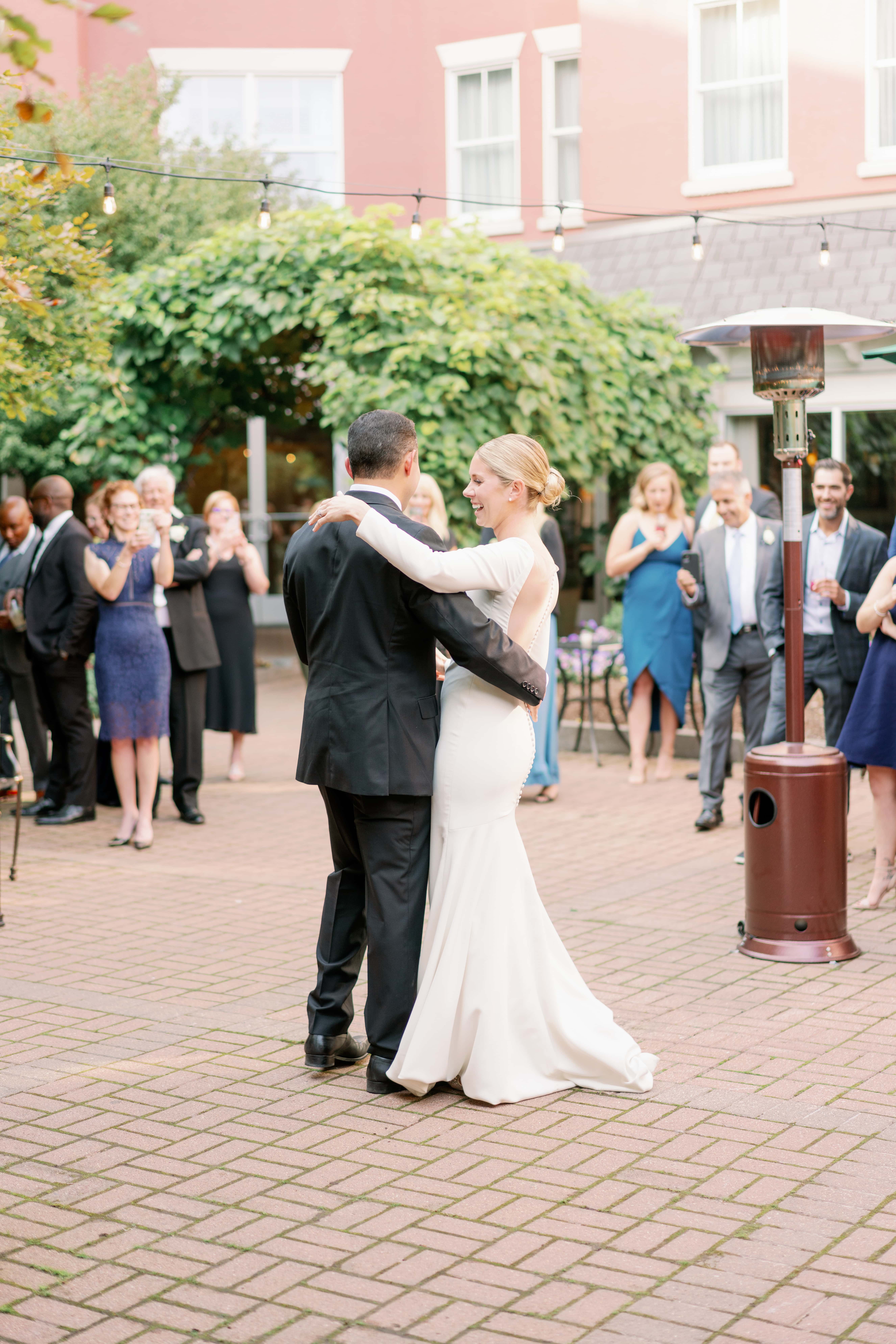 10 Dreamy Mansion Wedding Venues in New England: Couple dancing in the middle of the venue at Misselwood, with their guests looking on and filming