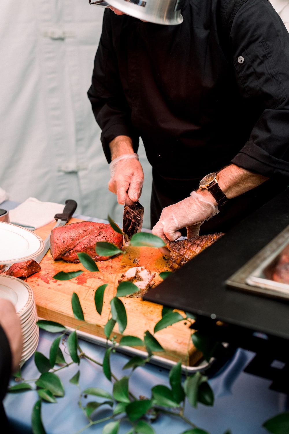 A Guide for Planning a Fairmont Copley Plaza Wedding in Boston: Close-up shot of vendor cutting up meat slices at the reception.